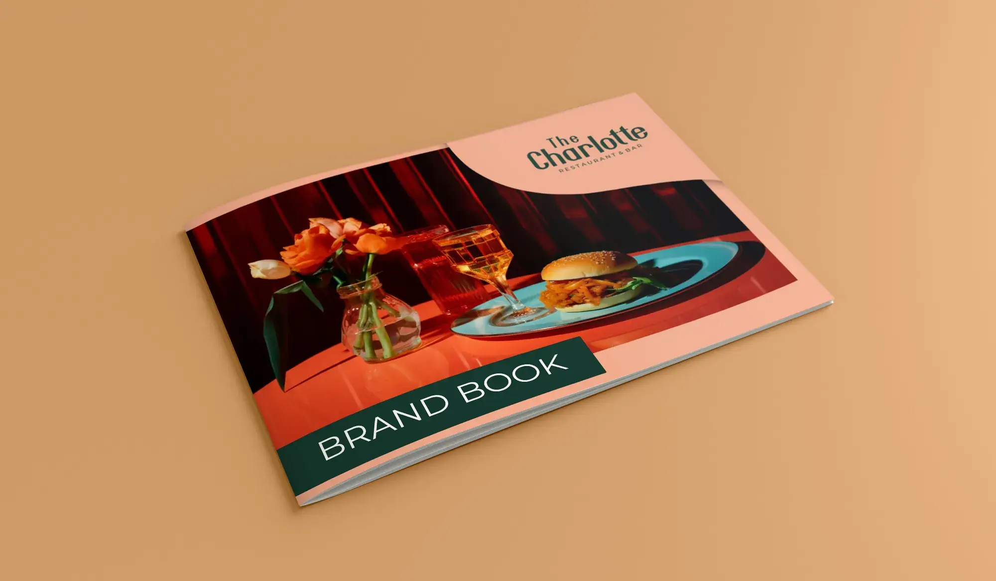 The Charlotte brand book front cover on tan